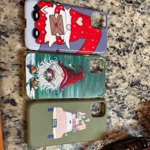 Three different IPhone cases.Two are Christmas One is Valentines Day